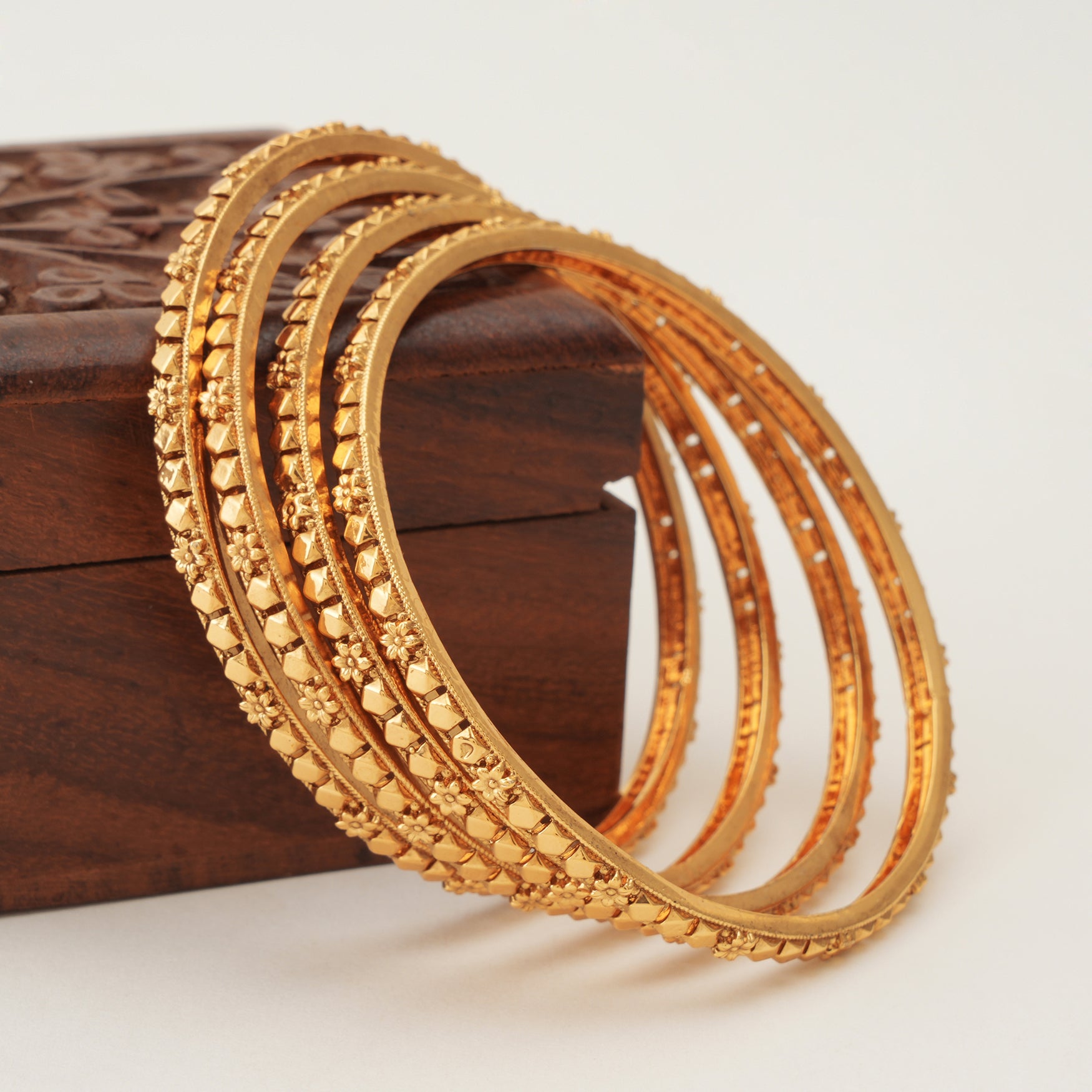 Plain sleek gold bangle set (set of 4)