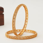 Plain floral gold bangle set