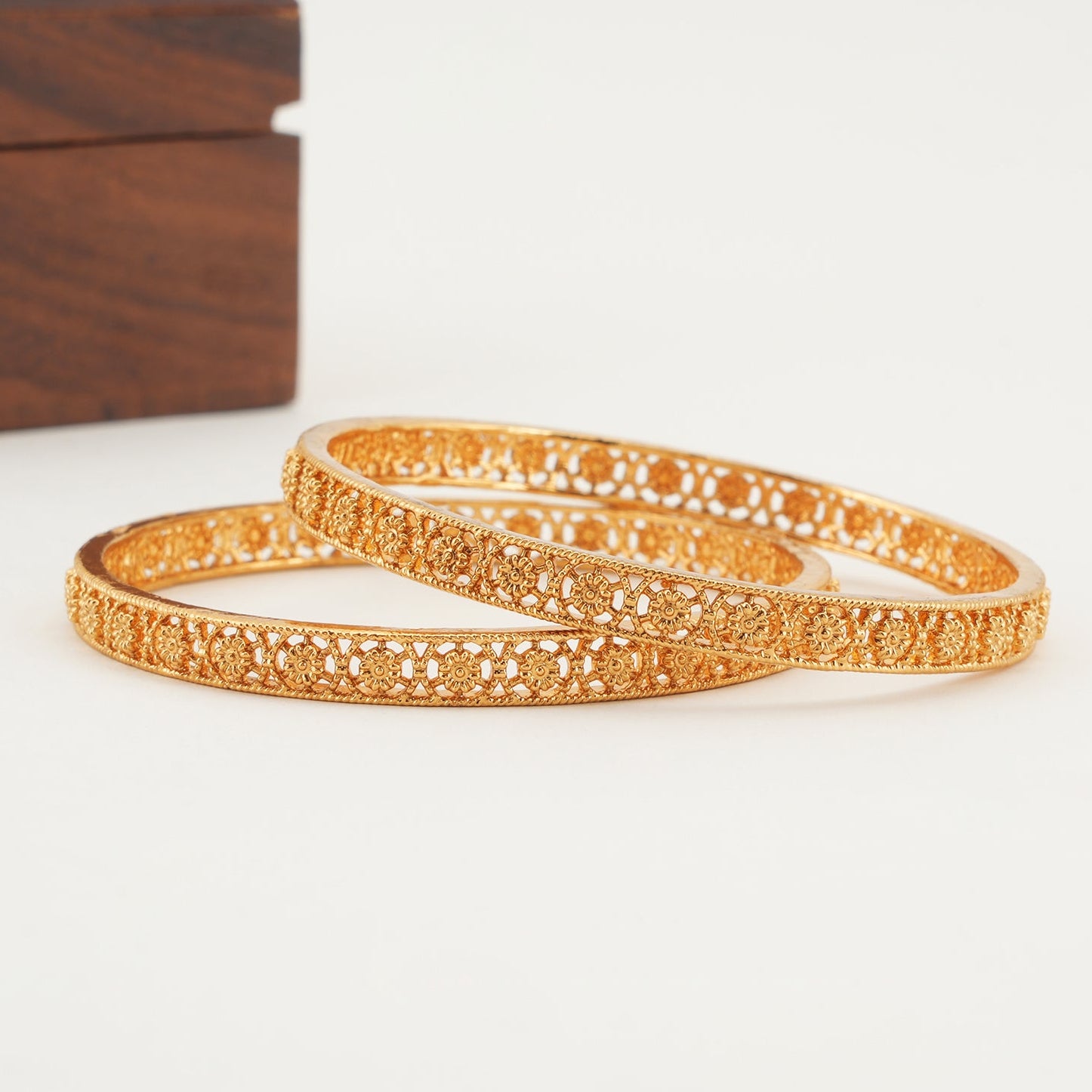 Plain floral gold bangle set