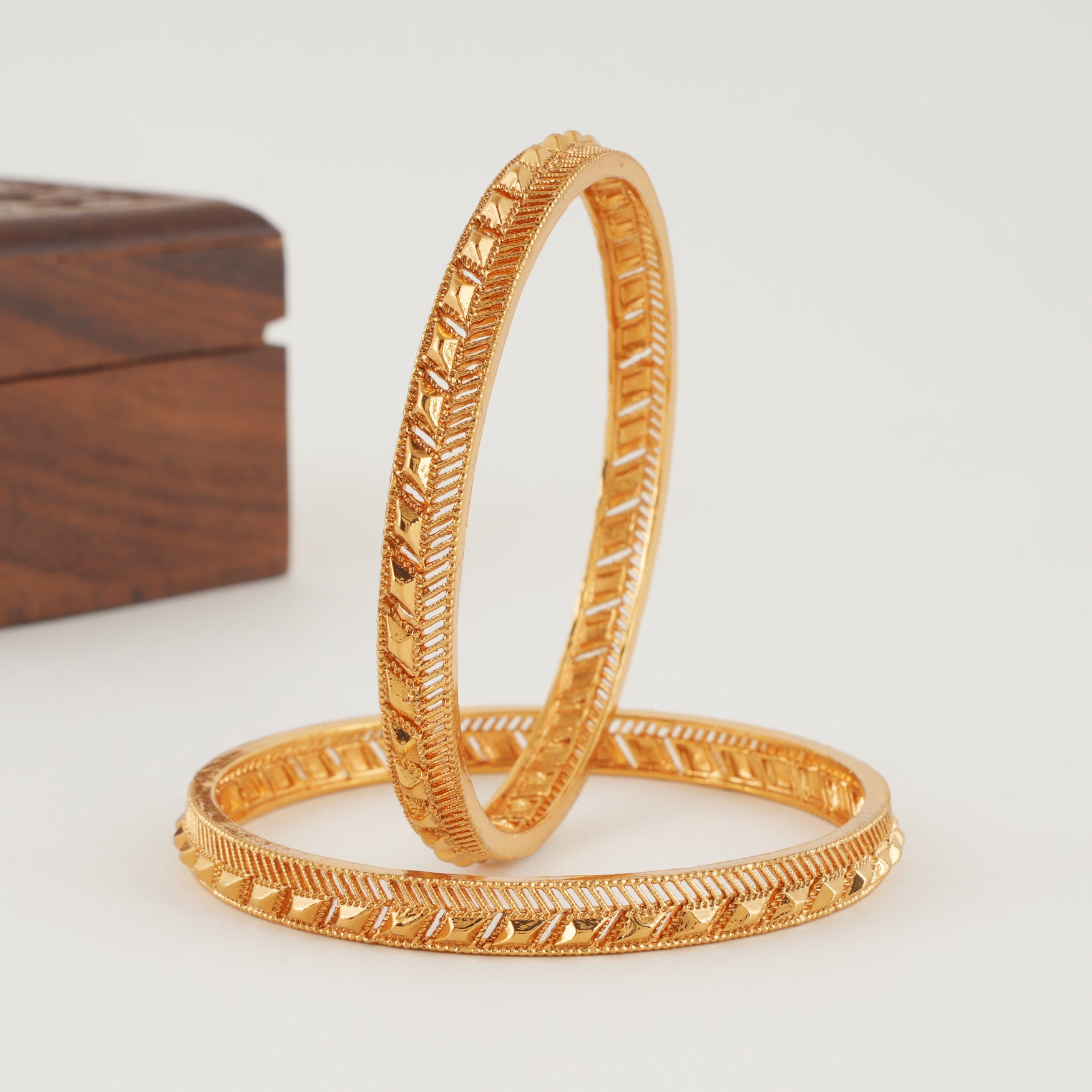 Sleek plain gold bangle set