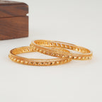 Sleek plain gold bangle set