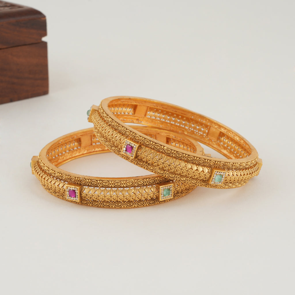 Beautiful intricate plain gold bangle set