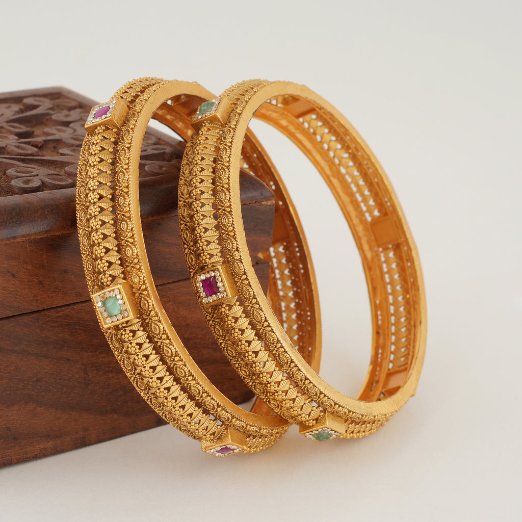 Beautiful intricate plain gold bangle set