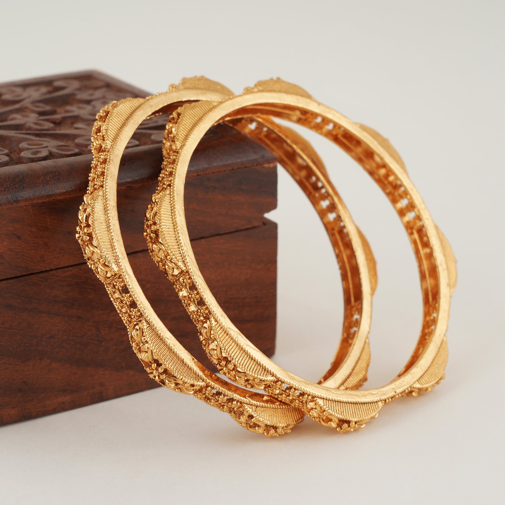 Plain intricate gold bangle set