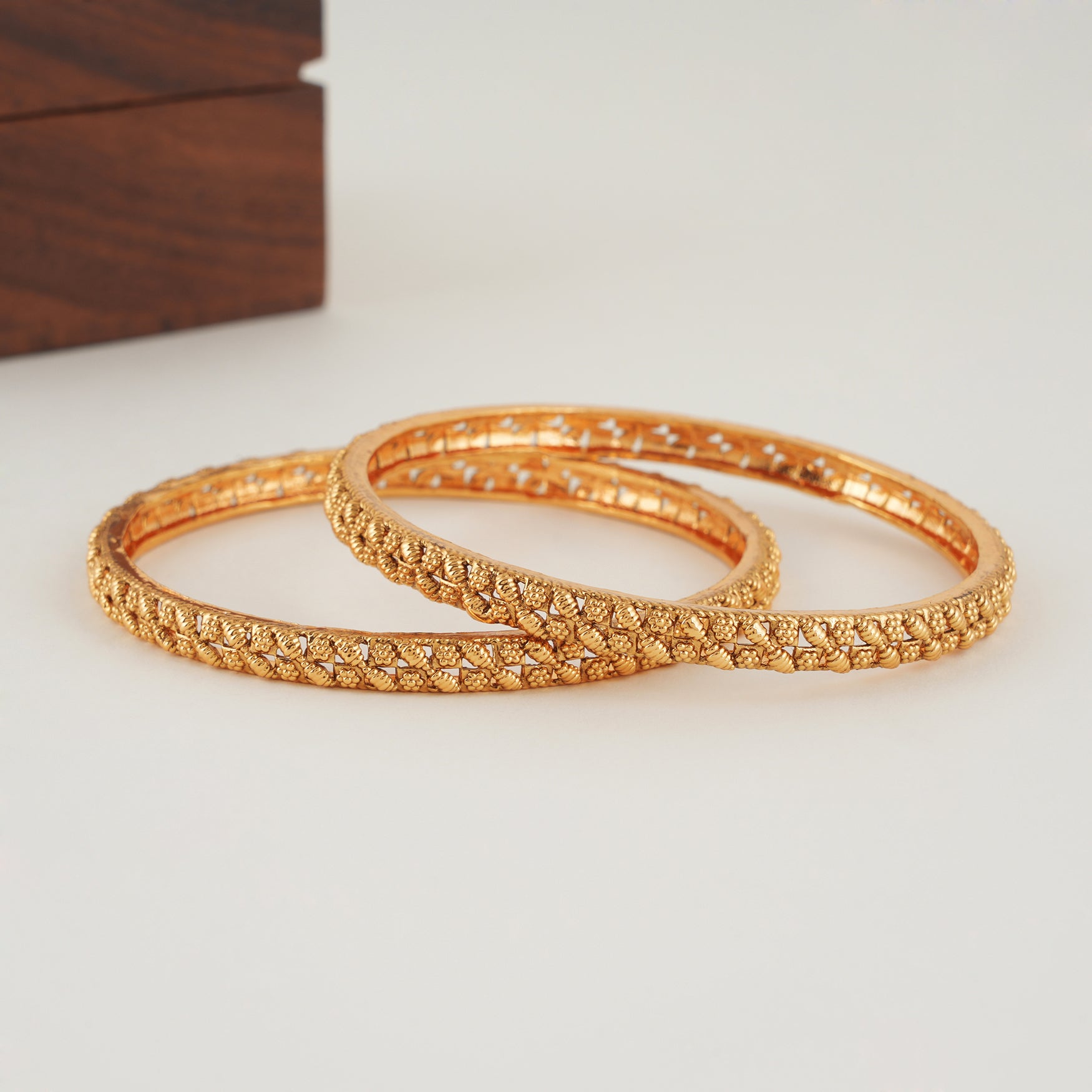Sleek leaf plain gold bangle set