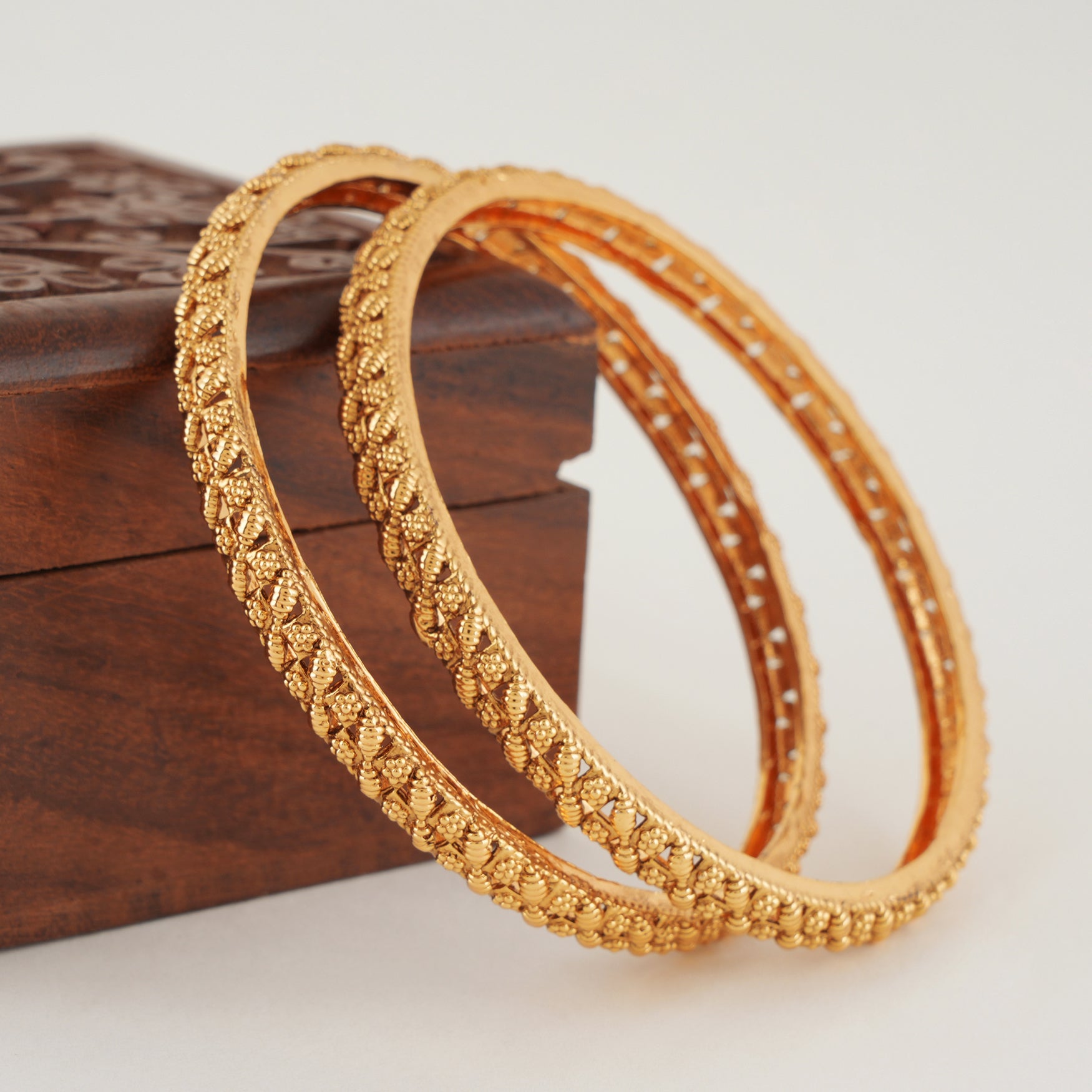 Sleek leaf plain gold bangle set