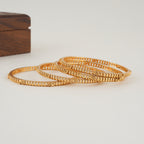 Plain intricate gold bangle set (set of 4 )