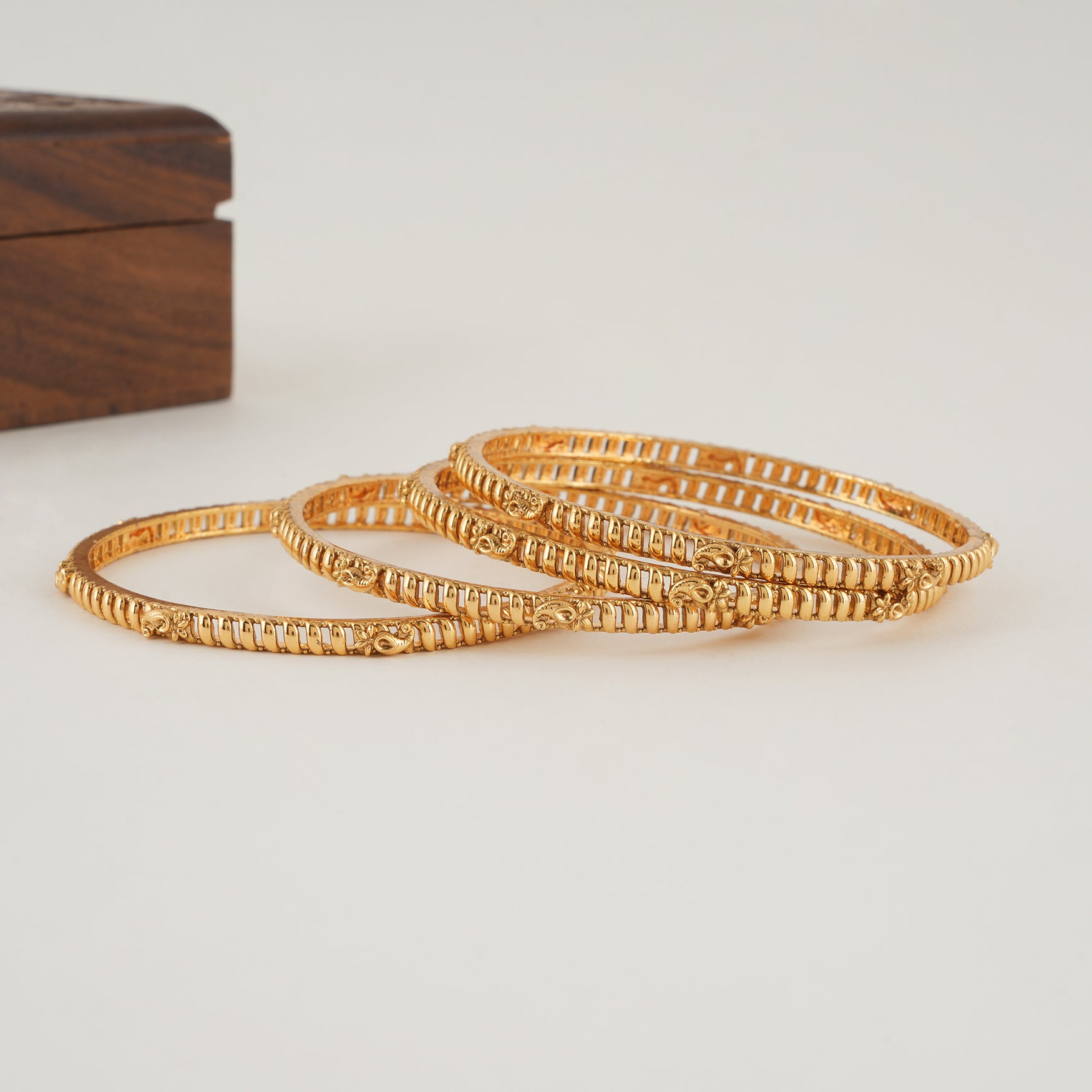 Plain intricate gold bangle set (set of 4 )