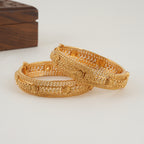 Beautiful intricate broad gold bangle set