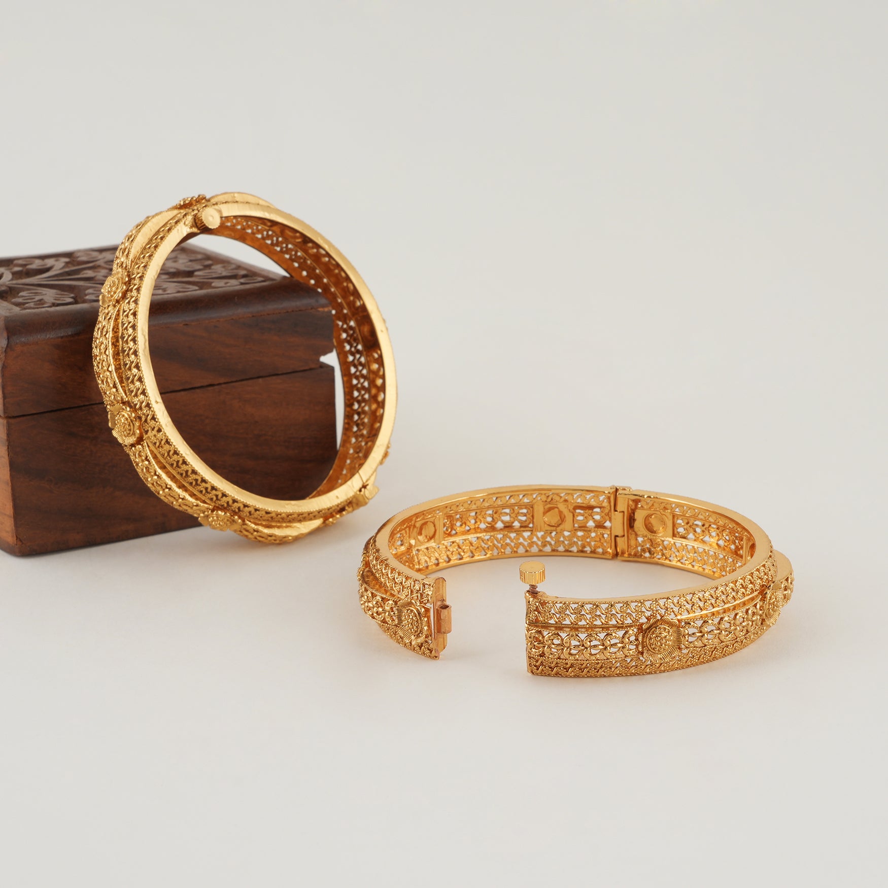 Beautiful intricate broad gold bangle set