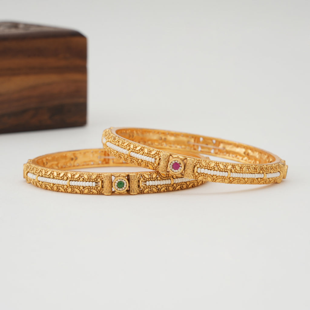Stunning pearl line stone gold bangle set