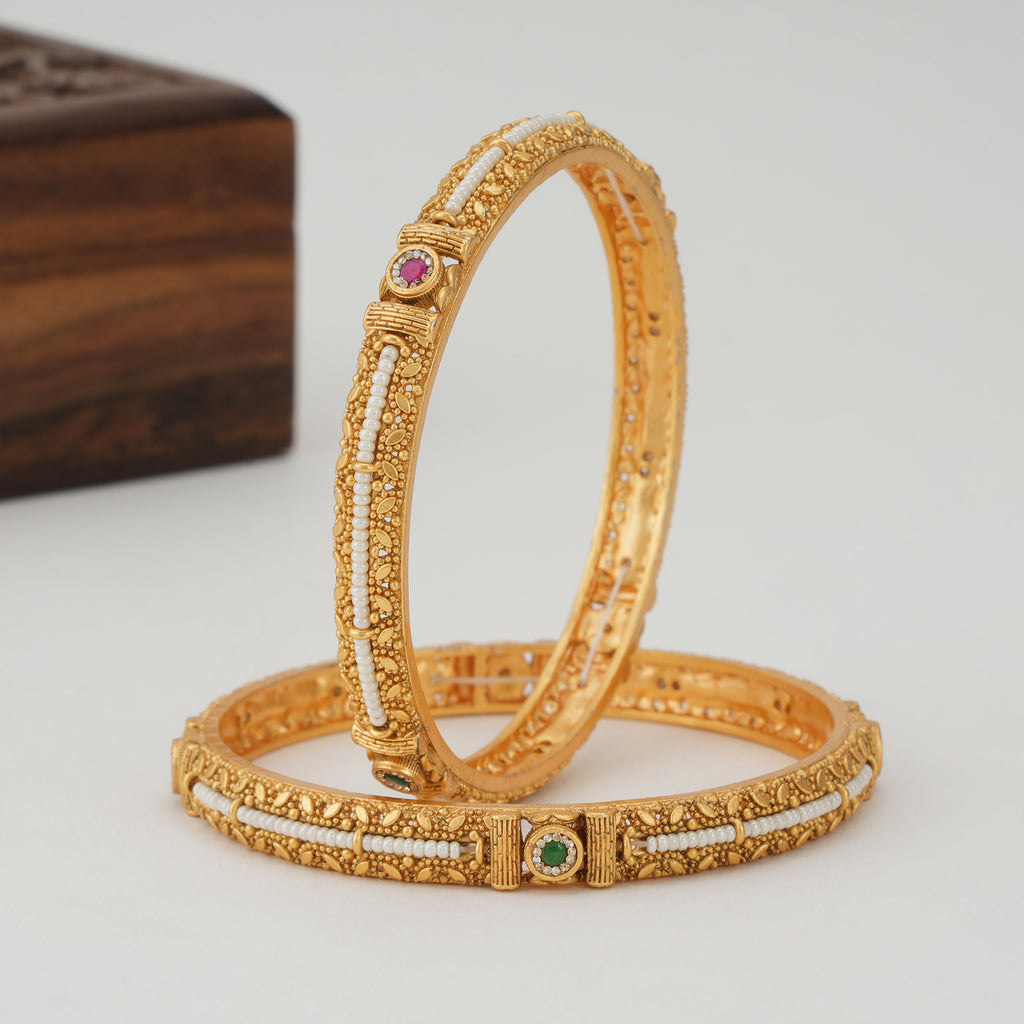 Stunning pearl line stone gold bangle set