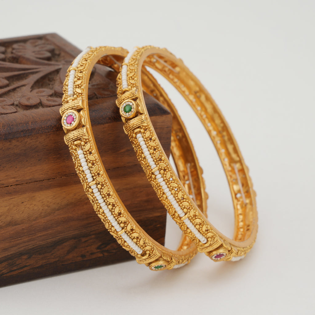 Stunning pearl line stone gold bangle set