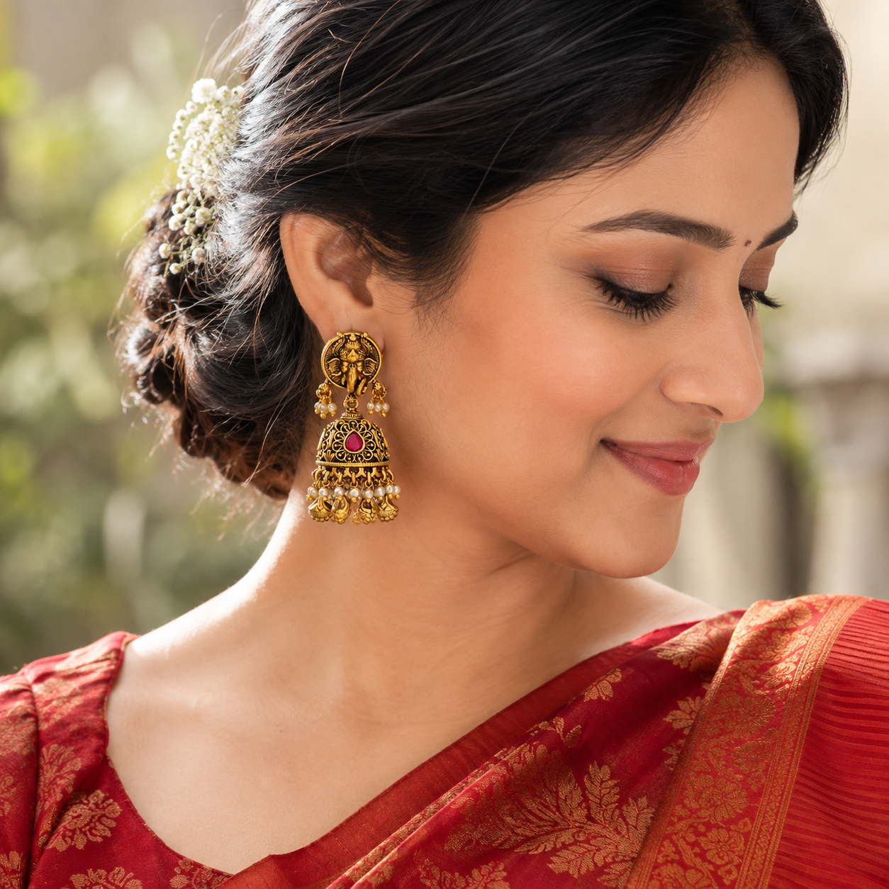 Lord Ganesh gold ruby jhumka earring
