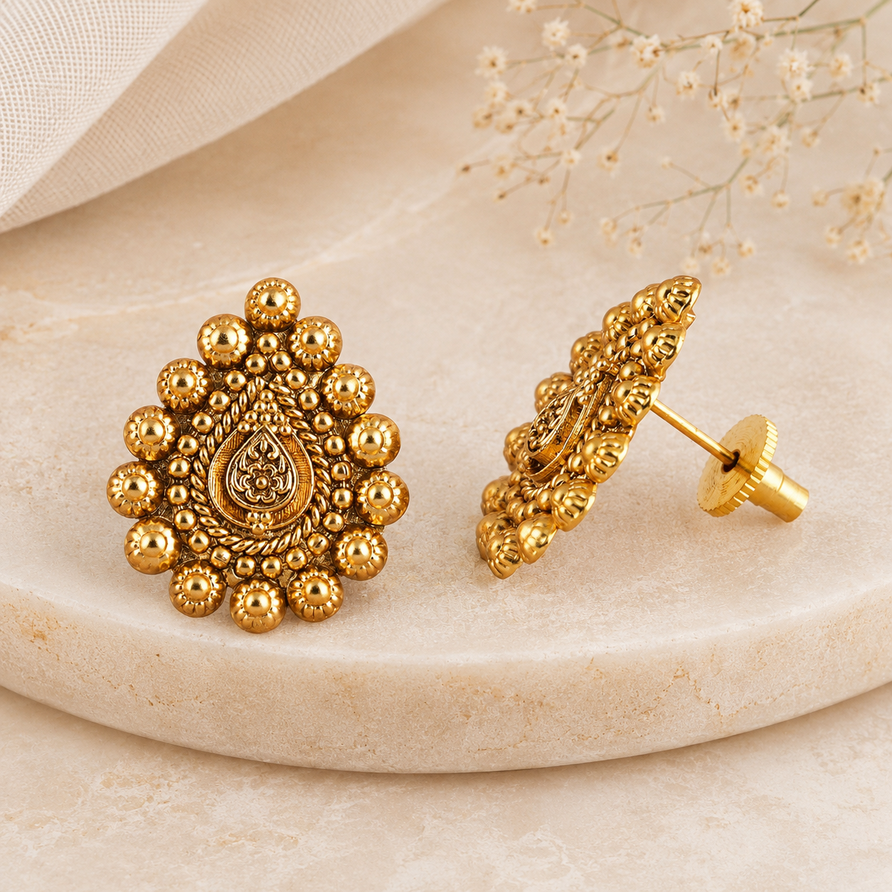 Stunning antique gold pear shape stud