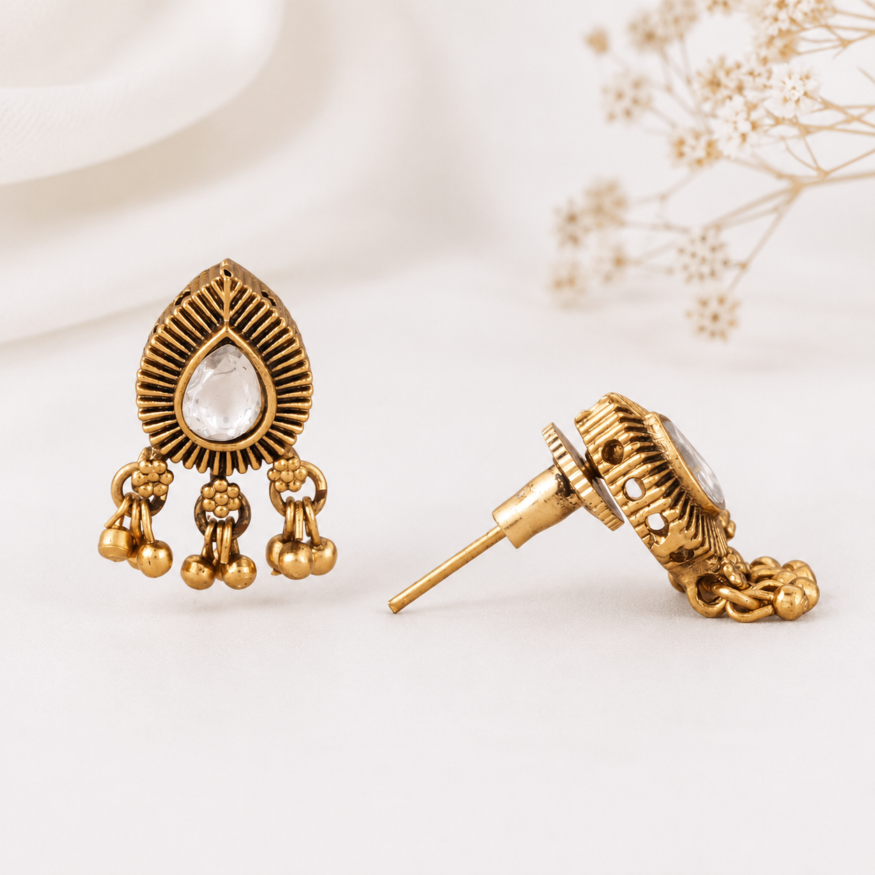 Cute kundan stone antique gold pear shape earring