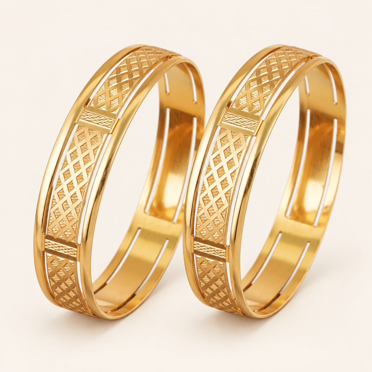 Broad gold plated carved bangle set