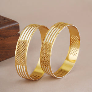 Bold dual tone gold bangle set