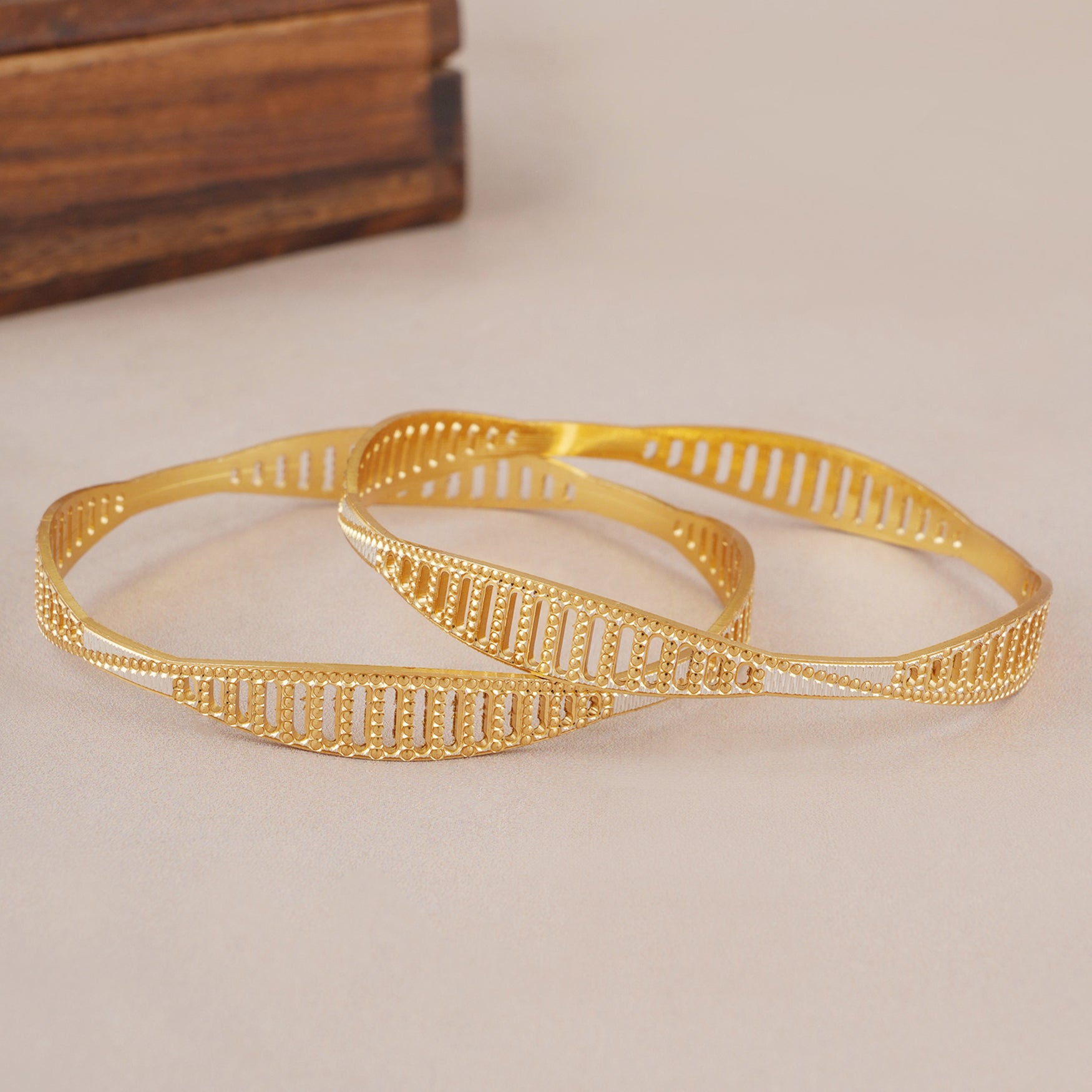 Spiral dual tone gold plated bangle set