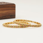 Sleek antique gold stone bangle set