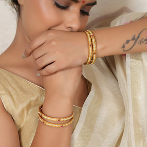 Elegant gold plated pearl bangle set (set of 4)