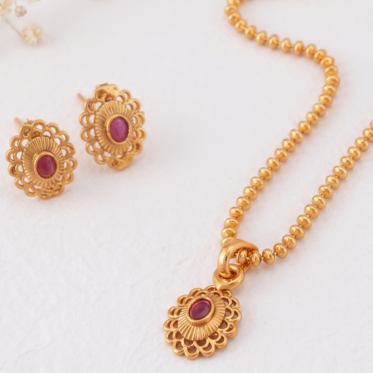 Cute oval ruby gold plated pendant set