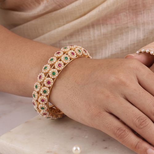 Beautiful gold finish pearl studded stone kada