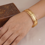 Broad gold plated carved bangle set