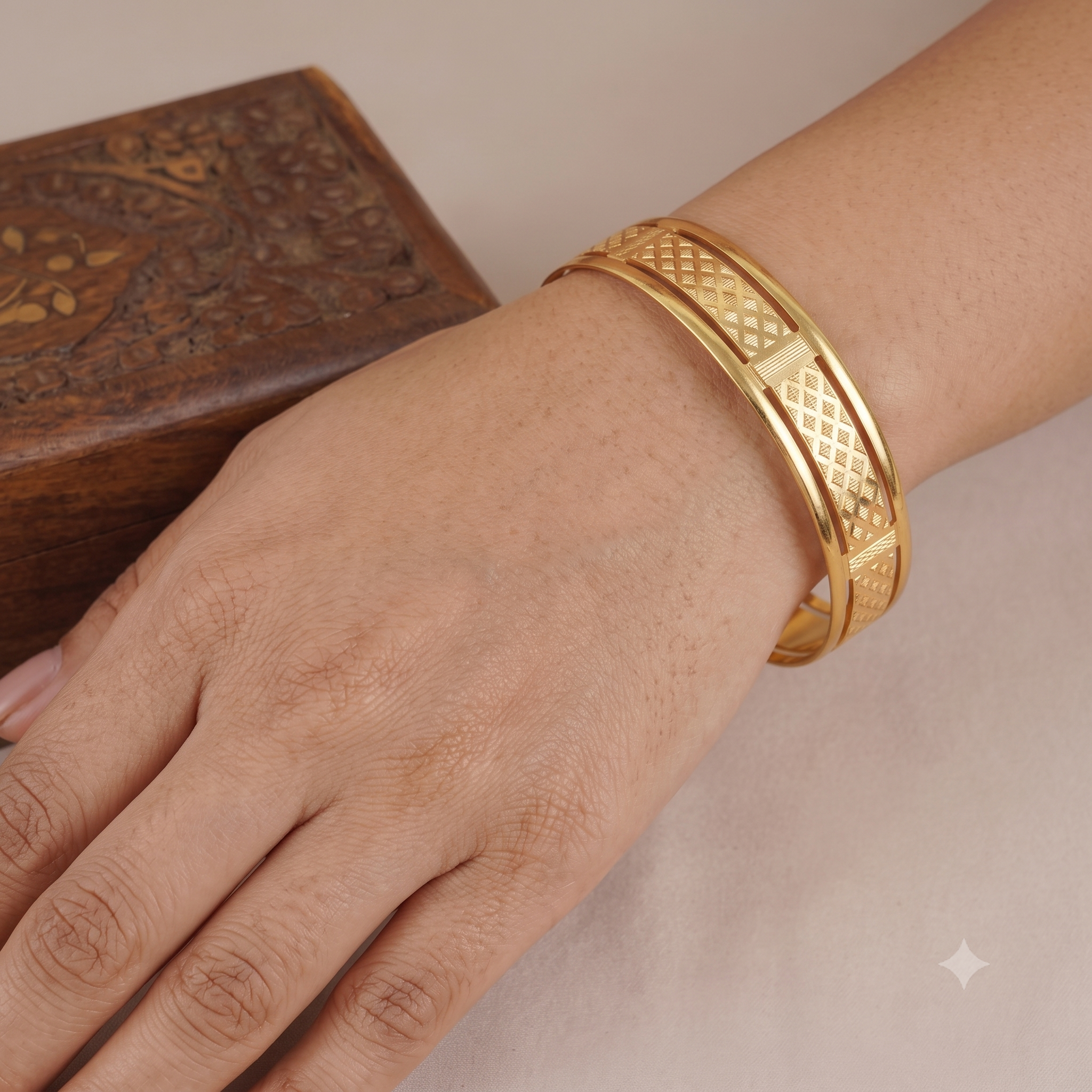 Broad gold plated carved bangle set