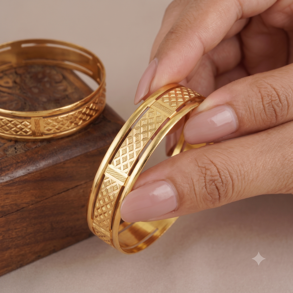 Broad gold plated carved bangle set
