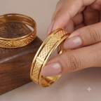 Broad gold plated carved bangle set