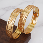 Broad gold plated carved bangle set