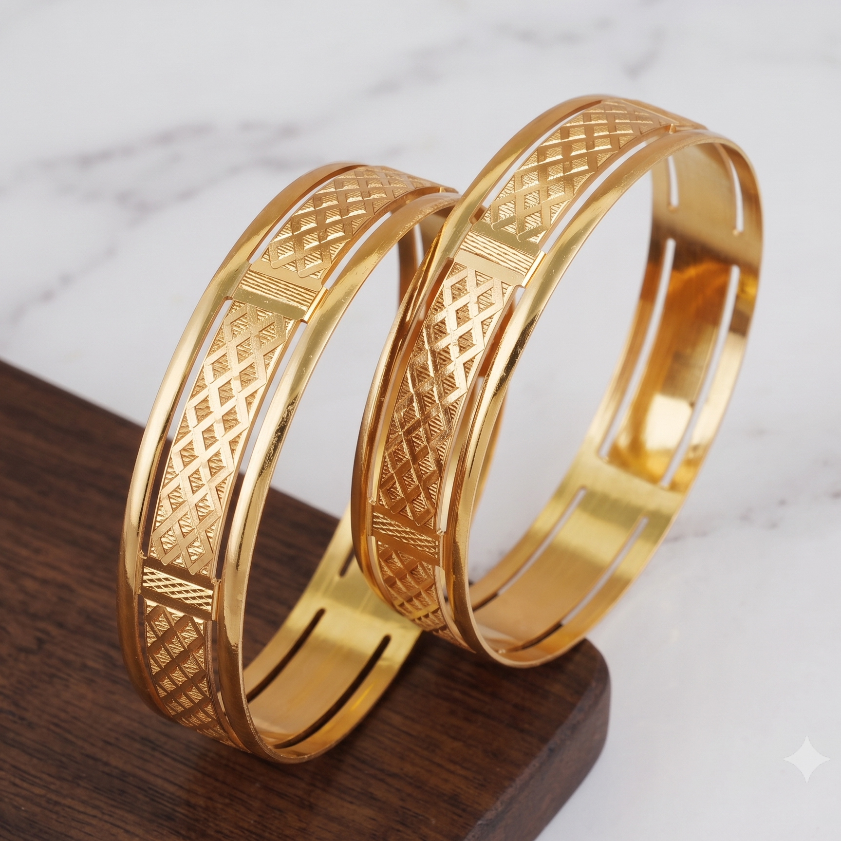 Broad gold plated carved bangle set