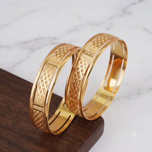 Broad gold plated carved bangle set