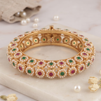 Beautiful gold finish pearl studded stone kada