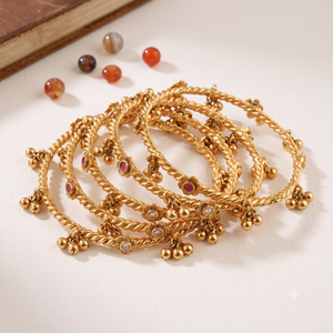 Beautiful antique gold stone ghungroo bangle set ( set of 4 )