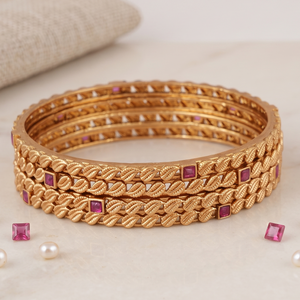 Sleek antique gold ruby stone bangle set